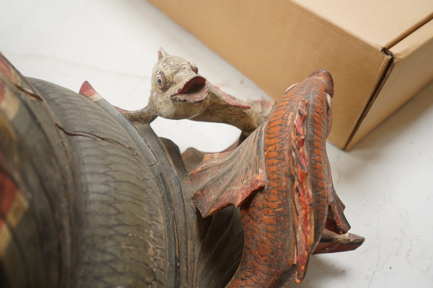 A large carved and painted wood hanging fish